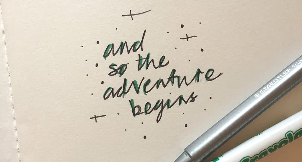 Sheet of paper that reads "and so the adventure begins"