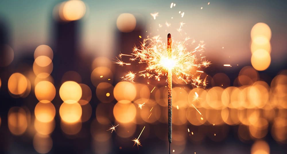 Sparkler with blurred busy city light background