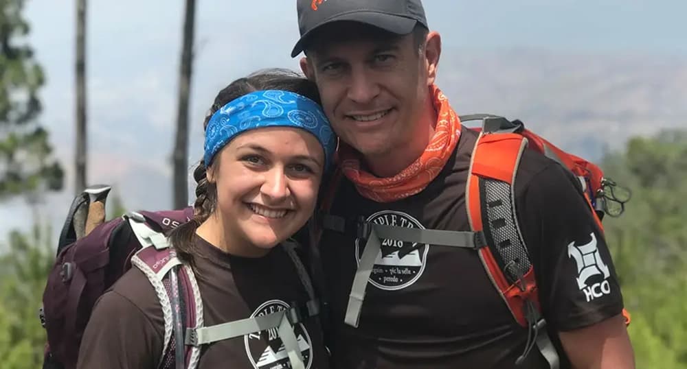 Author and her dad hiking in the mountains