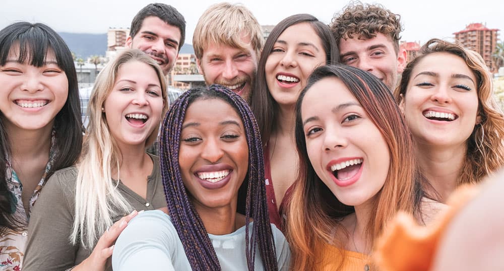 Group of college students smile at the camera