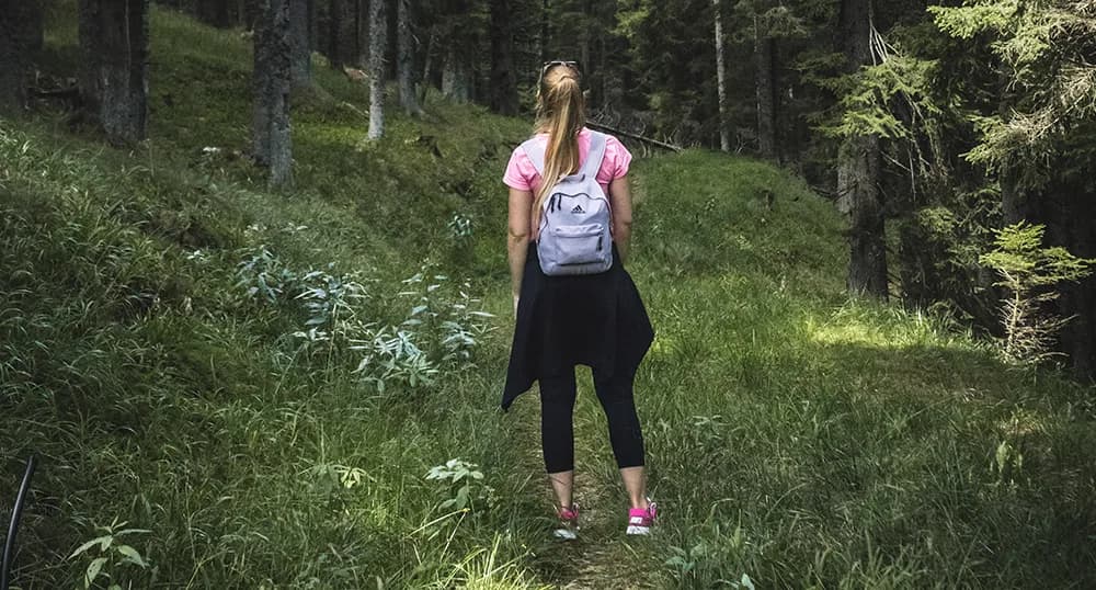 Woman walking in the woods