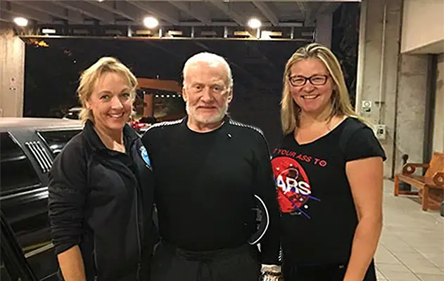 Buzz Aldrin stands with his daughter